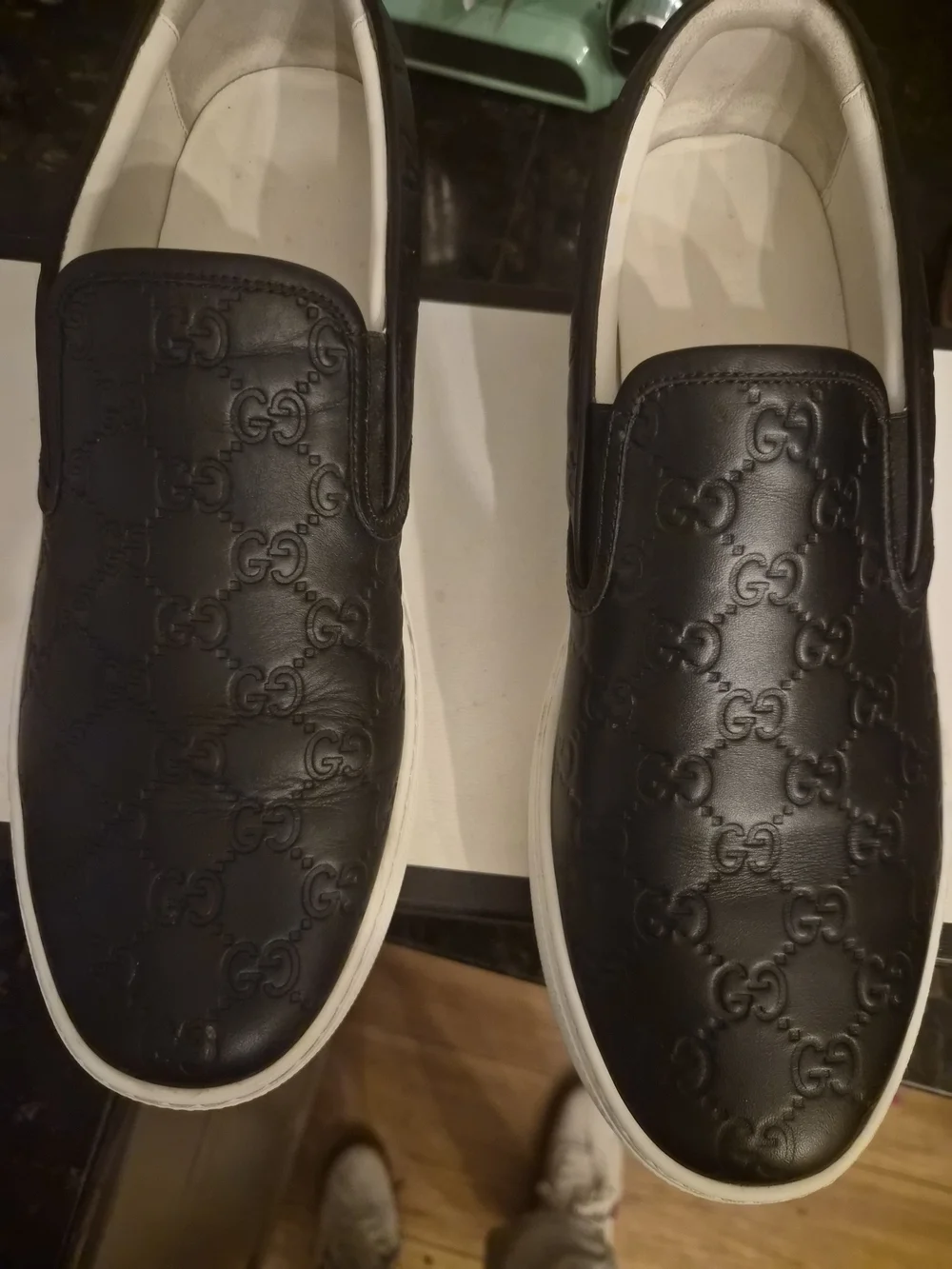 Gucci Black Embossed GG Leather Slip-On Sneakers with White Sole